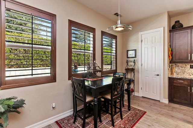 dining room with light wood-type flooring