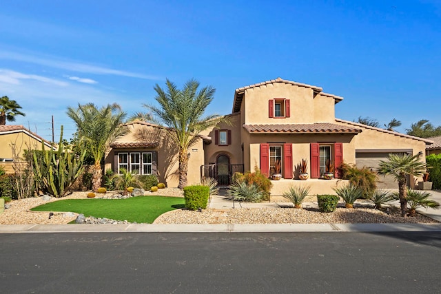 mediterranean / spanish-style house featuring a garage