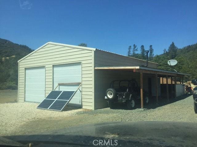 garage featuring a carport