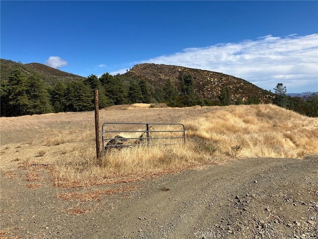 property view of mountains featuring a rural view