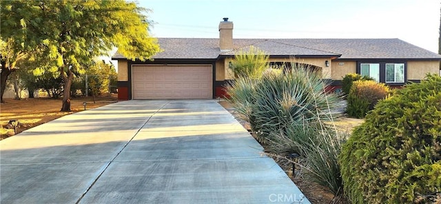 single story home with a garage