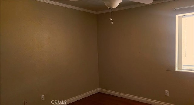 spare room with ceiling fan, dark hardwood / wood-style floors, and ornamental molding