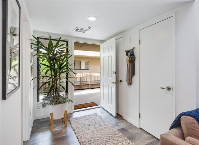 entryway with hardwood / wood-style flooring