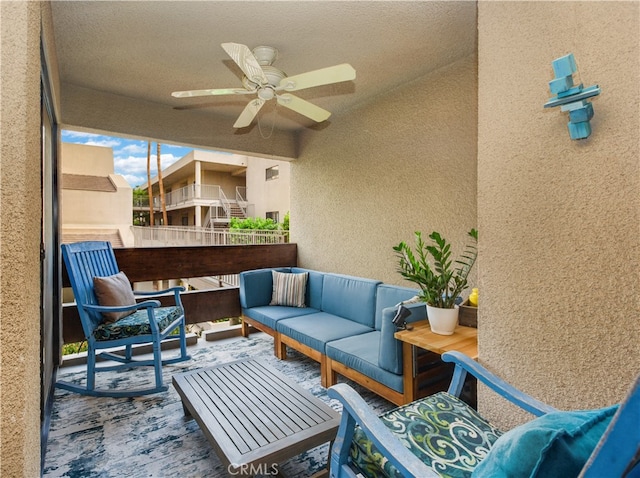 view of patio featuring ceiling fan, a balcony, and outdoor lounge area