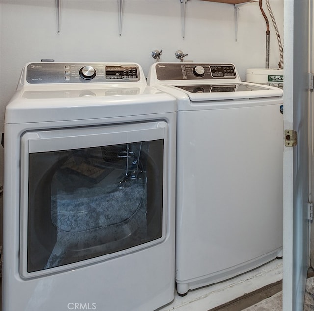 washroom featuring separate washer and dryer