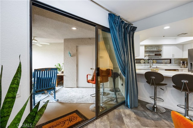 interior space with light wood-type flooring and ceiling fan