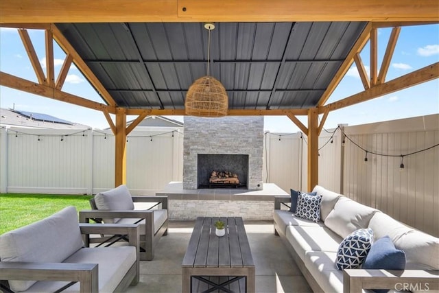 view of patio featuring an outdoor living space with a fireplace