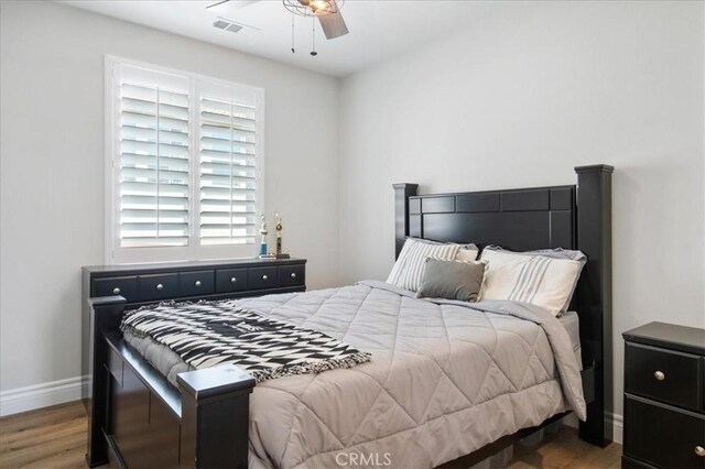 bedroom featuring ceiling fan and wood-type flooring