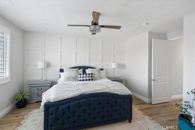 bedroom featuring ceiling fan and light wood-type flooring