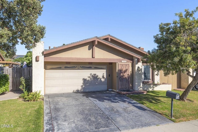 single story home with a garage and a front lawn