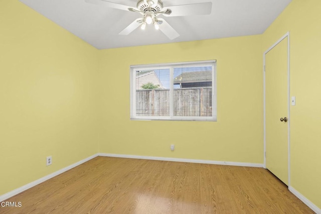 empty room featuring light hardwood / wood-style flooring and ceiling fan