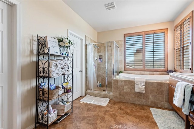 bathroom with tile patterned flooring and plus walk in shower