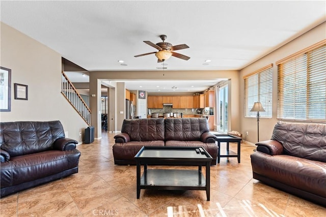 tiled living room featuring ceiling fan