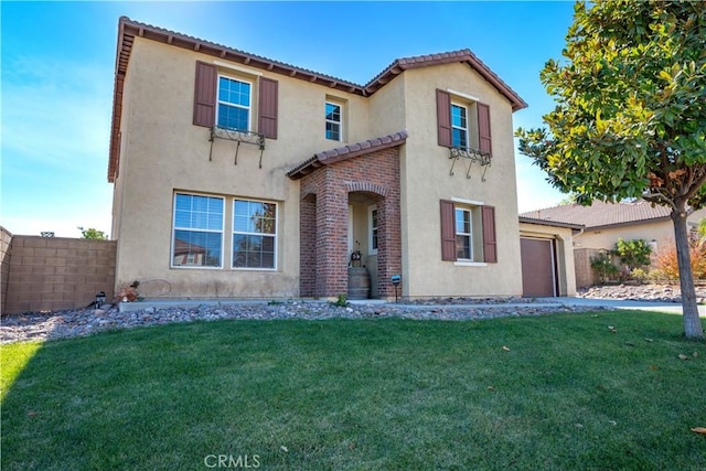 mediterranean / spanish-style home featuring a front yard