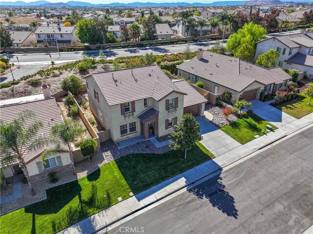 birds eye view of property featuring a mountain view