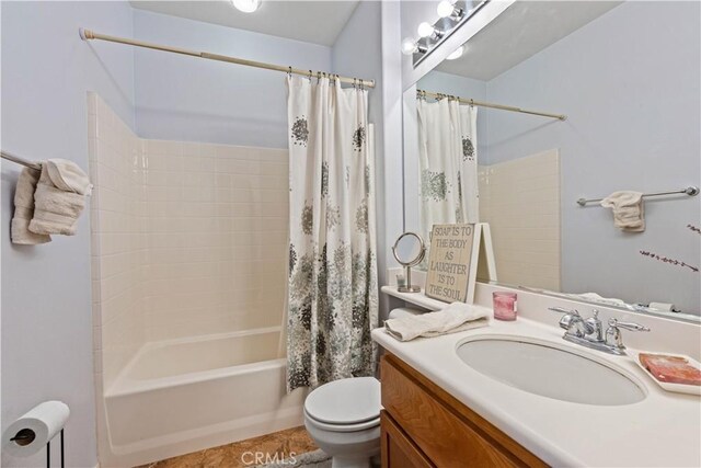 full bathroom featuring vanity, toilet, and shower / bath combo with shower curtain