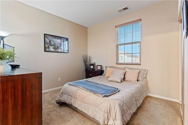 bedroom with light carpet