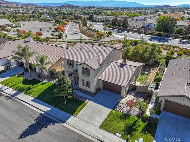 birds eye view of property with a mountain view