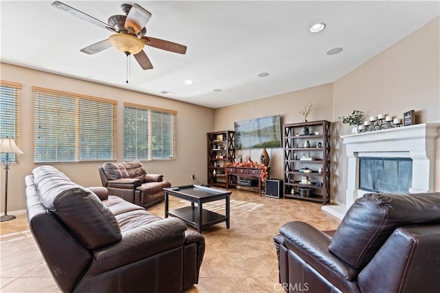 living room with ceiling fan and light tile patterned flooring