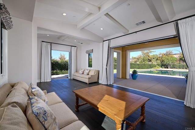 living room featuring dark wood-type flooring and lofted ceiling with beams