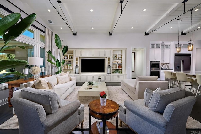 living room featuring beamed ceiling