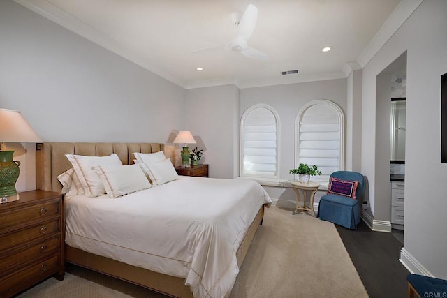 bedroom featuring hardwood / wood-style floors, ceiling fan, and ornamental molding