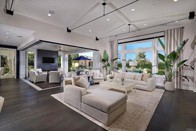 living room with ceiling fan, hardwood / wood-style floors, wood ceiling, and vaulted ceiling with beams