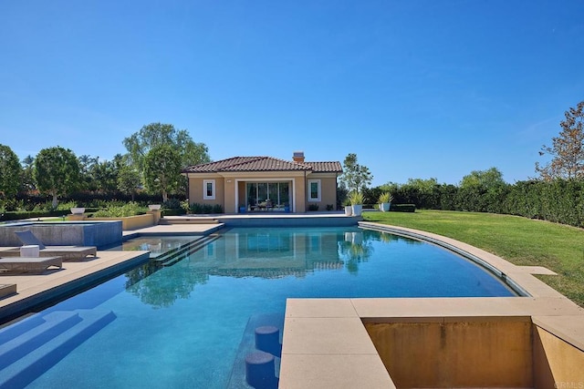 view of swimming pool featuring a lawn