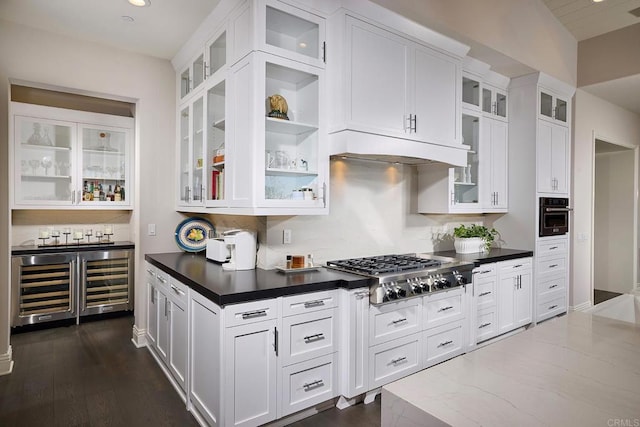 kitchen featuring white cabinetry, wall oven, and stainless steel gas cooktop