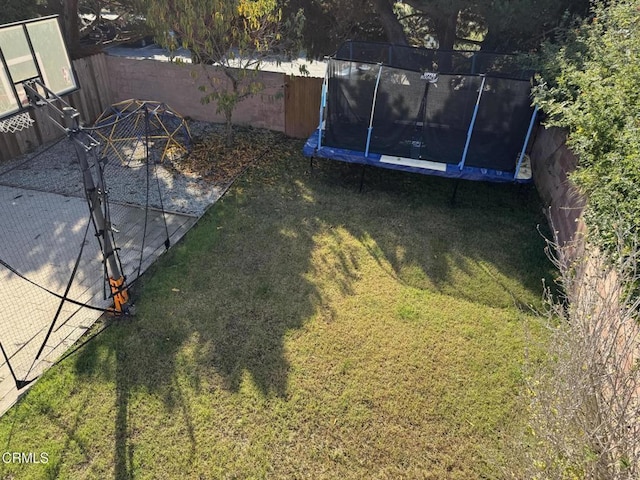 view of yard with a trampoline