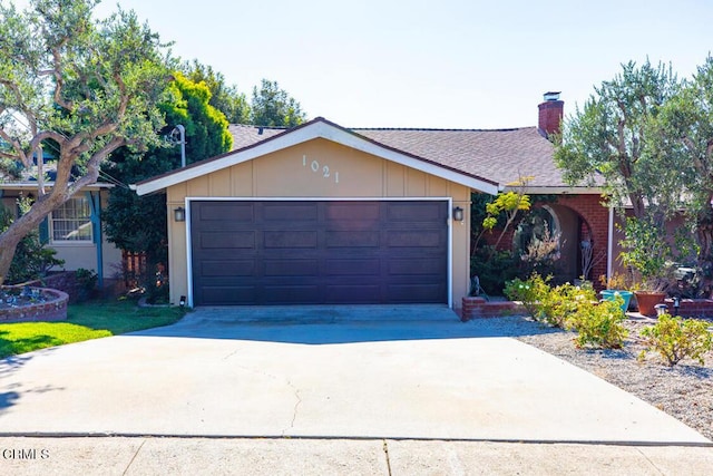 ranch-style home featuring a garage