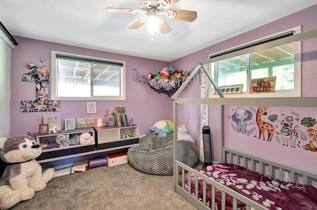 carpeted bedroom featuring ceiling fan