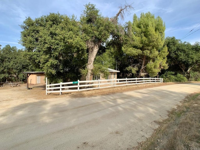 view of community with a storage shed