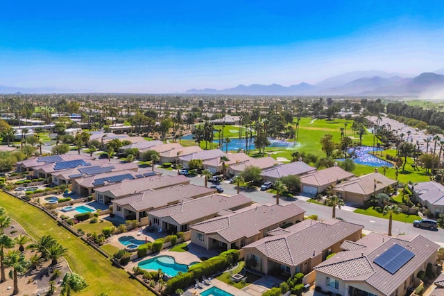 birds eye view of property with a mountain view