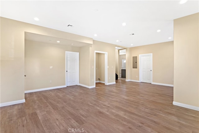 empty room with light hardwood / wood-style flooring