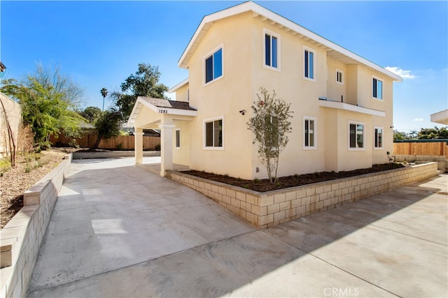 view of side of home featuring a patio