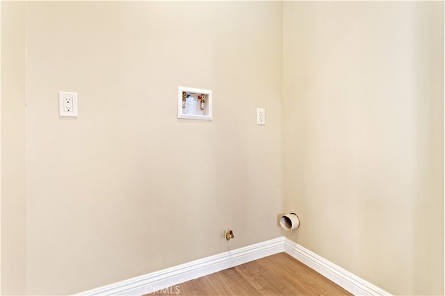 washroom with hookup for a washing machine and hardwood / wood-style floors