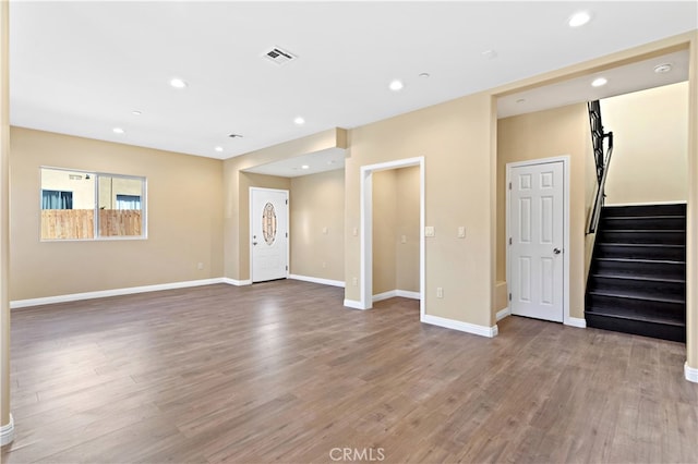 unfurnished living room featuring hardwood / wood-style floors