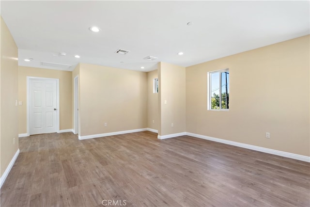 unfurnished room featuring light hardwood / wood-style floors