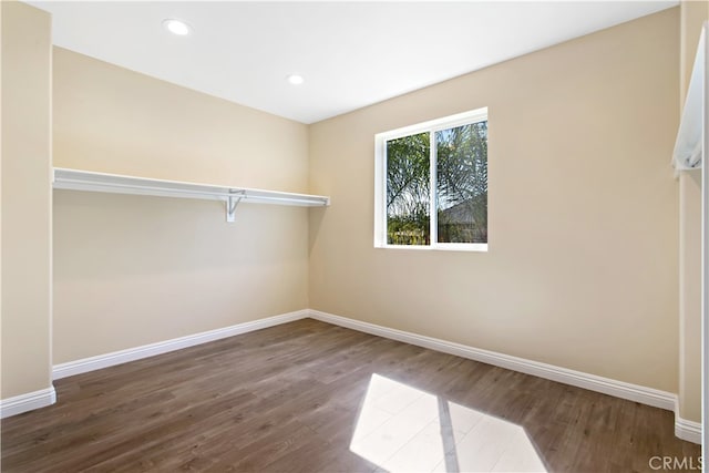 spare room with hardwood / wood-style flooring