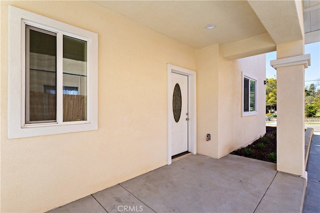 doorway to property featuring a patio