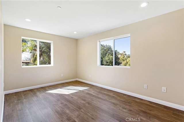 spare room featuring hardwood / wood-style floors