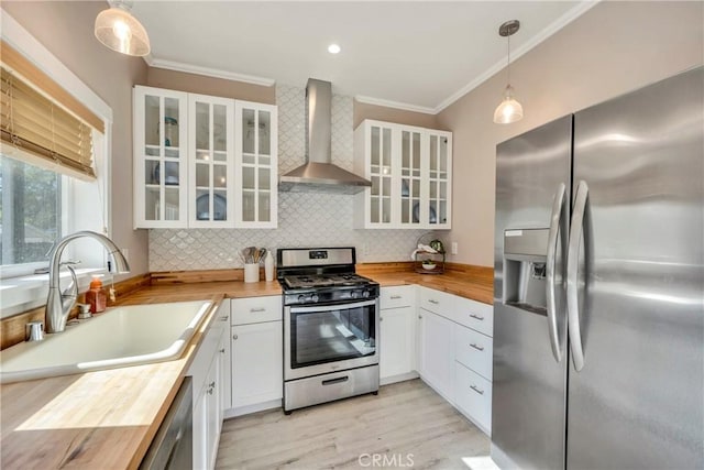 15425 Graham St, Middletown, CA 95461 - kitchen featuring a sink, appliances with stainless steel finishes, wood counters, and wall chimney exhaust hood