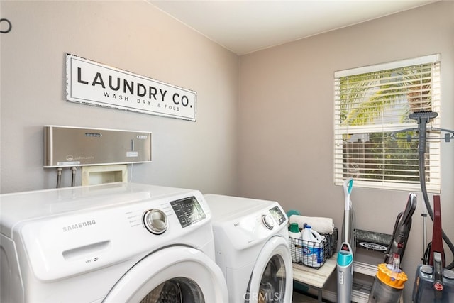 laundry area with independent washer and dryer