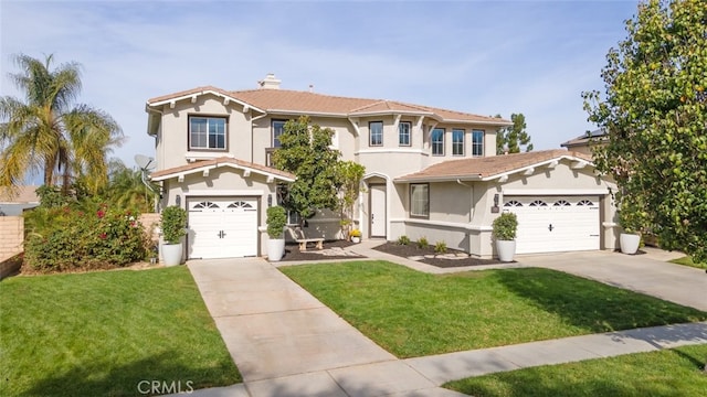 mediterranean / spanish-style house featuring a garage and a front lawn