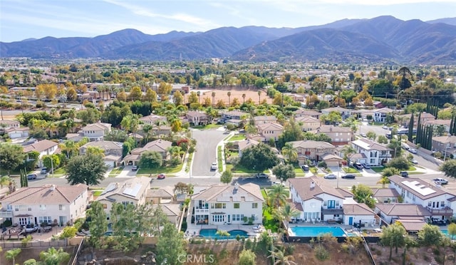 birds eye view of property featuring a mountain view