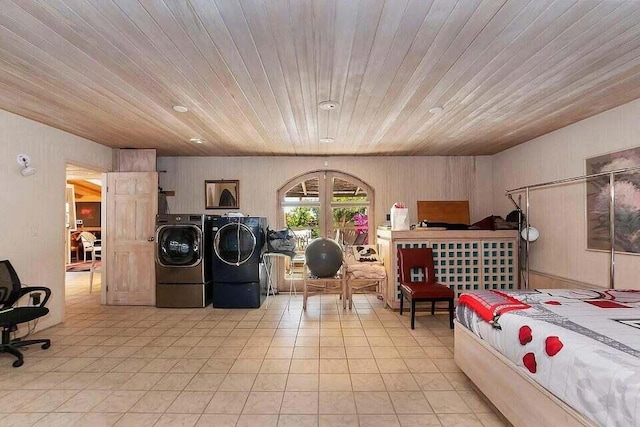 bedroom with wooden ceiling, wooden walls, and washing machine and clothes dryer