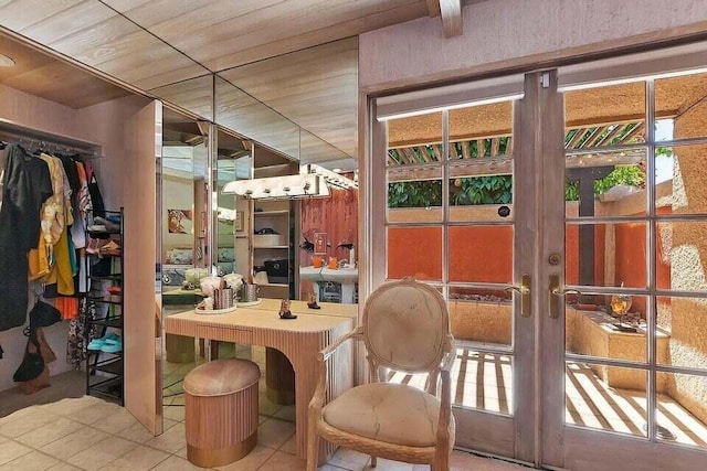 interior space featuring wood ceiling, tile patterned floors, and french doors