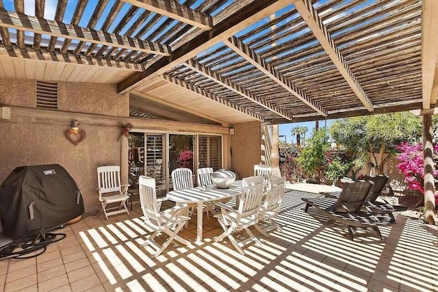 view of patio with grilling area and a pergola