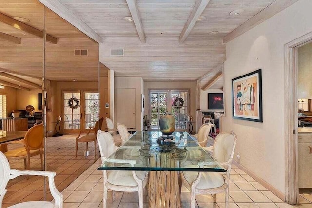 tiled dining area with wooden ceiling, beam ceiling, and french doors